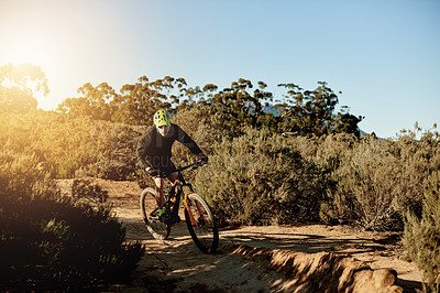 Buy stock photo Mountain bike, sports and man with dirt road race, workout or cardio exercise in nature. Fitness, triathlon and cyclist on dust trail for cycling competition, challenge or training with adventure.