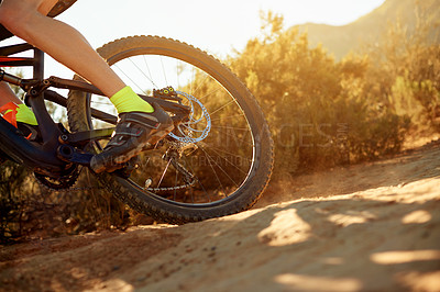 Buy stock photo Bike, off road and wheel with person in mountains for outdoor exercise, fitness or hobby. Dirt, trail and tyre with foot of cyclist in nature for challenge, performance or sports training closeup