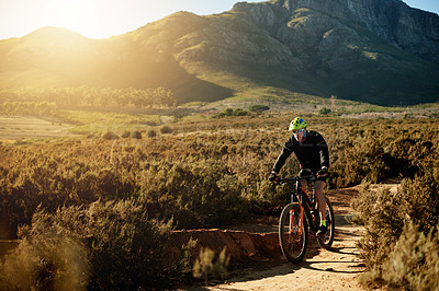 Buy stock photo Man, mountain bike or cycling with dirt road for fitness, adventure or extreme sport in nature. Male person, cyclist or riding with bicycle for cardio workout, adrenaline or exercise on path or trail