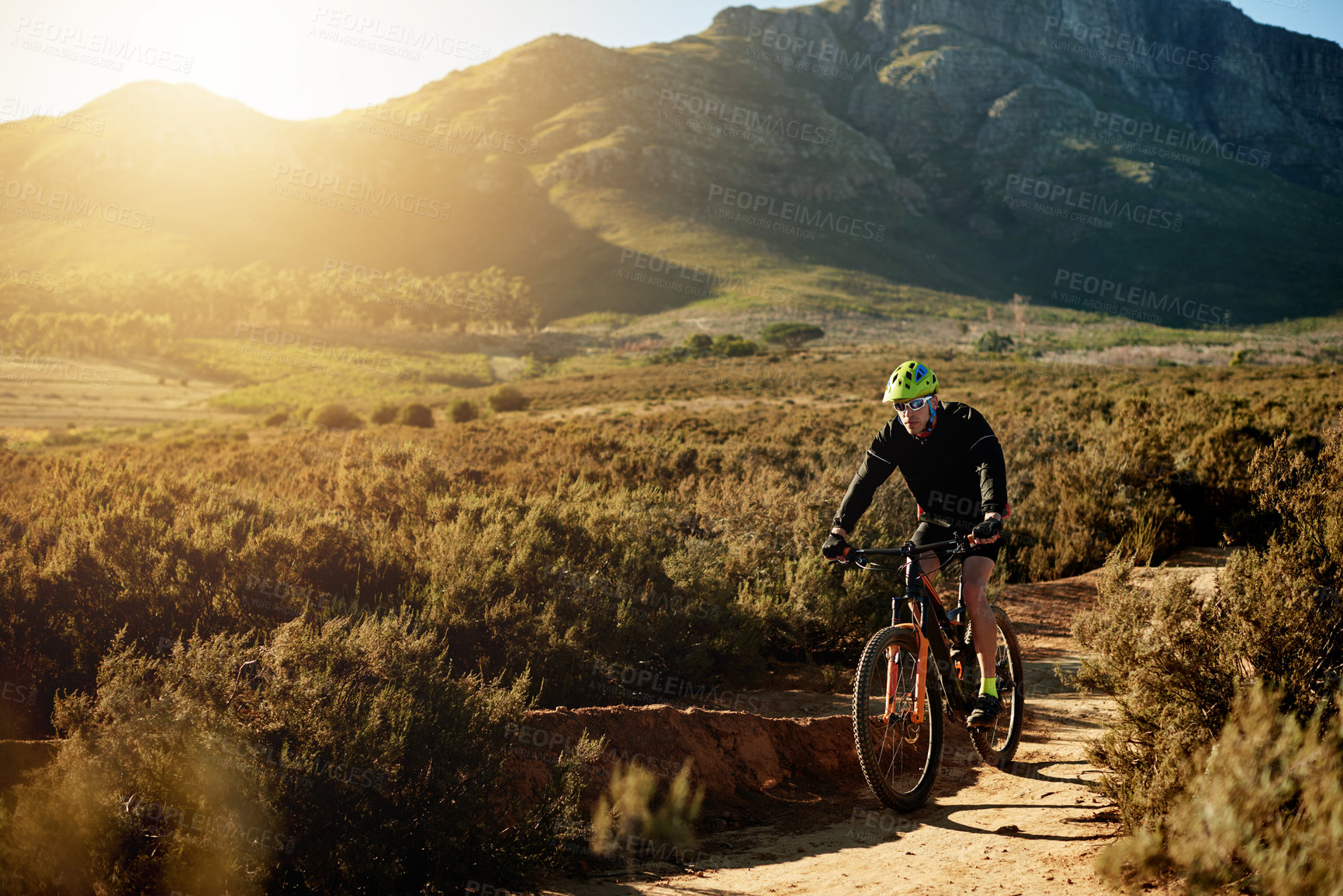Buy stock photo Man, mountain bike or cycling with dirt road for fitness, adventure or extreme sport in nature. Male person, cyclist or riding with bicycle for cardio workout, adrenaline or exercise on path or trail