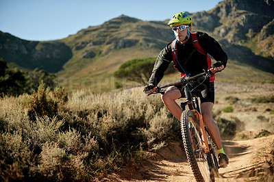 Buy stock photo Mountain, cycling and man with bicycle, speed and fitness for race in nature, carbon footprint and trail. Outdoor, adventure and person with eco friendly transport, environment and performance