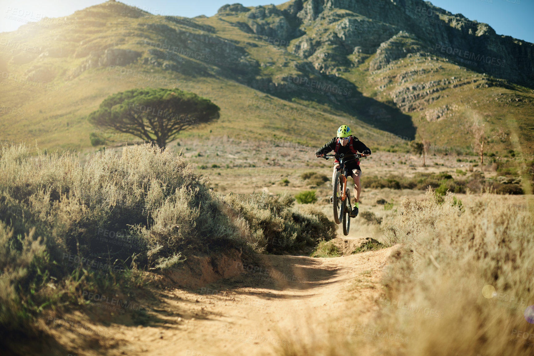 Buy stock photo Mountain, cycling and man with bicycle, fitness and speed for race in nature, carbon footprint and trail. Outdoor, adventure and person with eco friendly transport, environment and performance