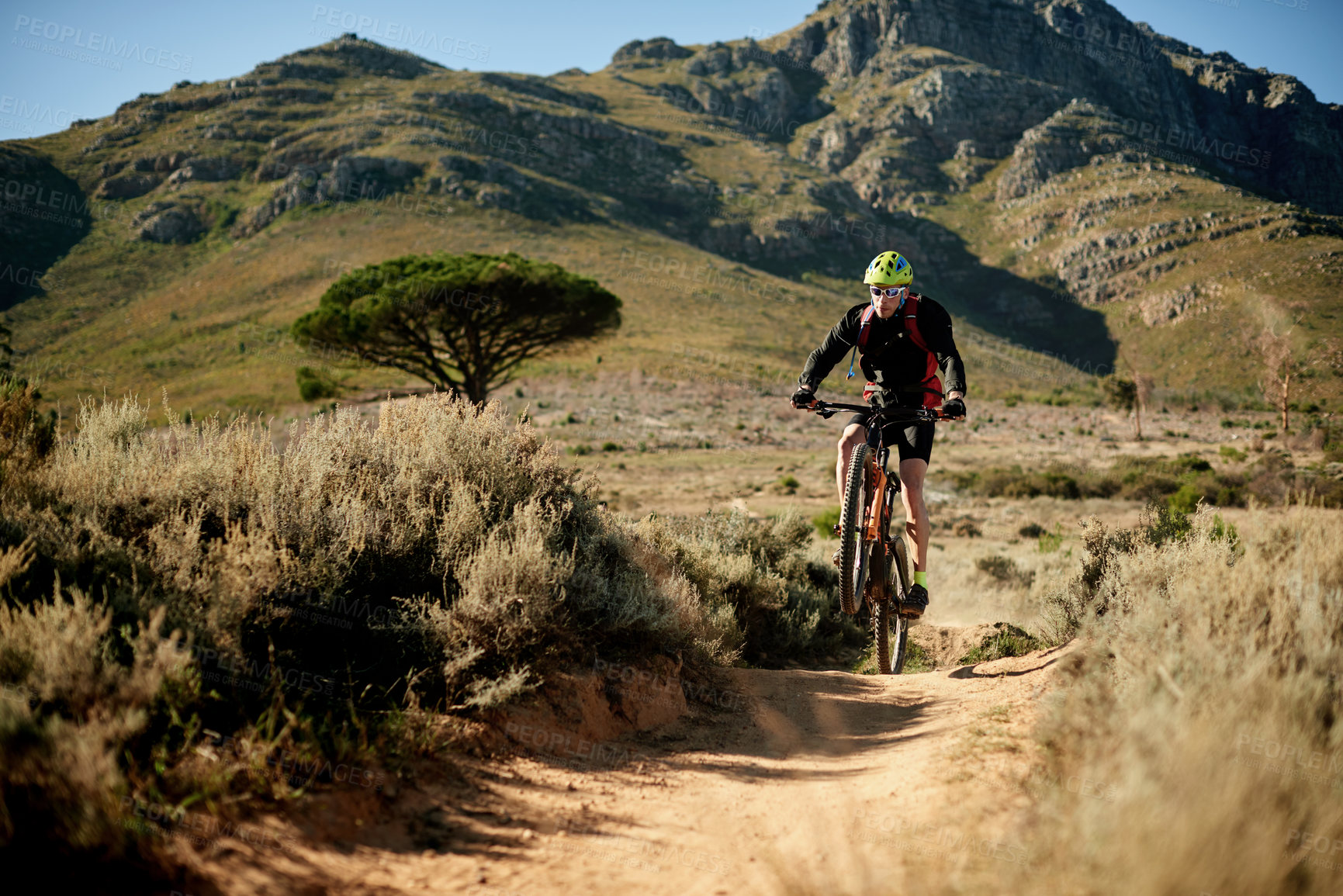Buy stock photo Mountain bike, dirt road and man with fitness, energy and hobby with adventure. Healthy person, extreme sports and cyclist with practice, travel or wellness with journey, challenge or competition