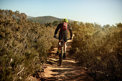 Buy stock photo Mountain bike, cycling and back of athlete with sports race, workout or cardio exercise on dirt road. Fitness, triathlon and cyclist riding on dust trail for competition training with adventure.