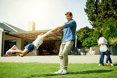 Buy stock photo Playing, spinning or swinging with dad and daughter outdoor in garden of home for bonding or fun. Happy, love and summer with family in backyard of apartment together for safety, security or trust
