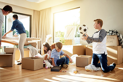 Buy stock photo Moving, family and parents with children, boxes and smile for new home, unpacking and real estate for investment. Property, ownership and people with kids in living room, love and mortgage for house