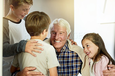 Buy stock photo Hug, love or smile with grandpa and kids in home together for bonding, relationship or visit. Family, happy and retirement with senior man talking to grandchildren in apartment or development