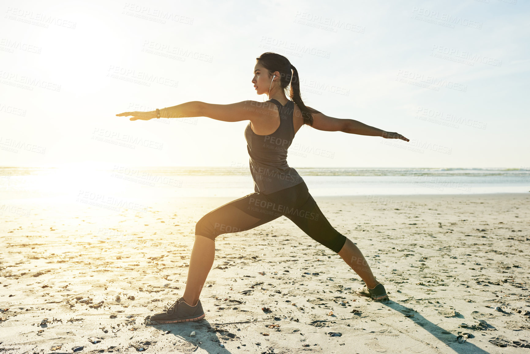 Buy stock photo Yoga, fitness and woman at sea in warrior pose for posture and holistic health for calm soul. Athlete, mockup or person stretching arms at beach for outdoor body exercise, chakra balance or training