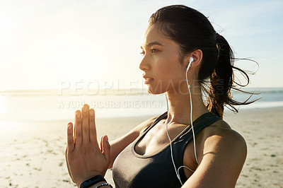 Buy stock photo Zen, meditation and woman with earphones, namaste and listening to chanting for peace, music or outdoor. Beach, mindfulness and streaming mantras on radio, calm or self awareness for person in nature