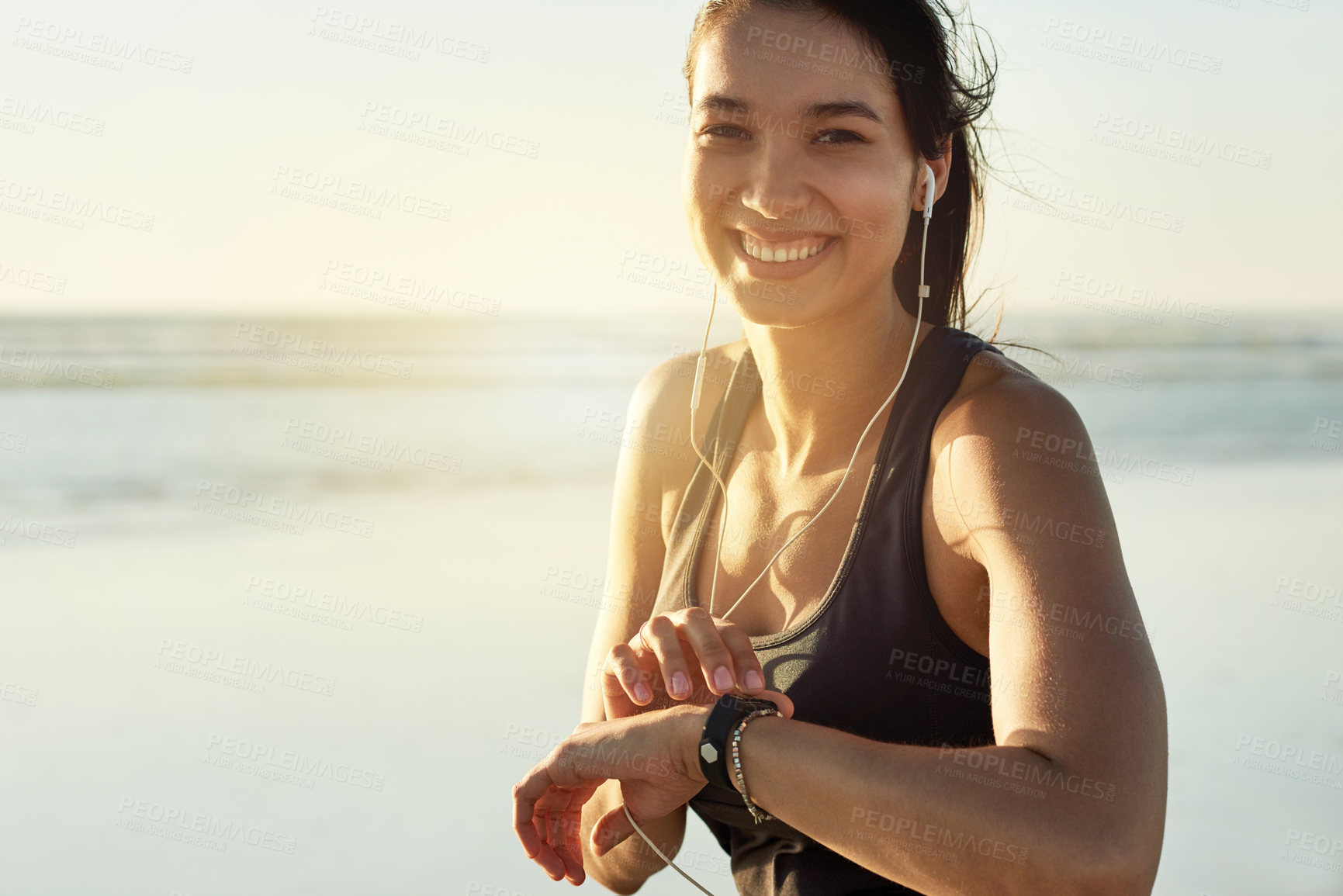 Buy stock photo Smart watch, fitness and portrait of woman at beach with exercise music, heart rate and smile at sunset. Face, wristwatch or sports athlete outdoor for steps, workout results or pulse for body health