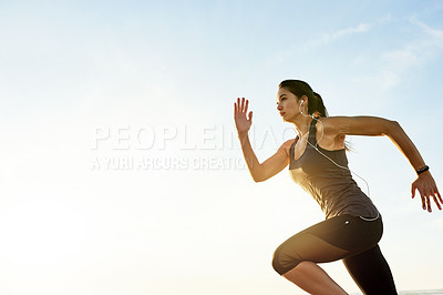 Buy stock photo Girl, running and exercise at sunrise with earphones, training or listen to music with mock up space in morning. Woman, person and sound with streaming, subscription and fitness with speed in Spain