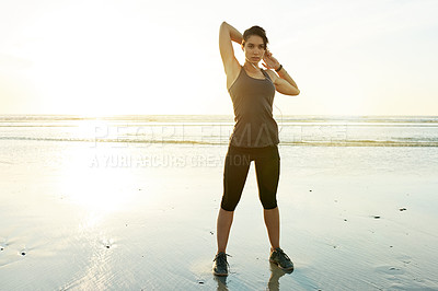 Buy stock photo Girl, stretching and earphones by ocean, sunset and ready for training in summer with streaming. Person, woman and workout with warmup, subscription and listen to music for fitness at beach in Spain