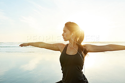 Buy stock photo Person, music or beach yoga at sunset for balance, calm or zen mindset in peace mockup space. Warrior pose, earphones or wellness frequency for awareness, stretching or relax body movement by ocean