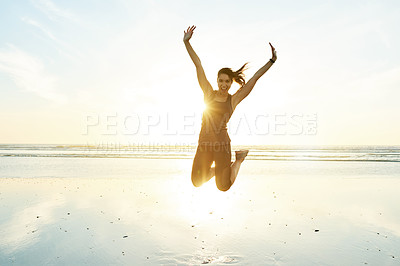 Buy stock photo Portrait, woman and jumping for fitness at beach with energy, freedom and celebration of exercise goals. Excited, female athlete or marathon winner with sports success, training achievement and ocean