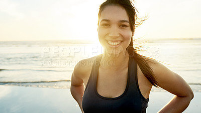 Buy stock photo Woman, smile or portrait on beach for fitness, wellness or exercise break at lens flare. Runner, sunset or windy at Colombia ocean for resting, commitment or pride for physical journey with sky space