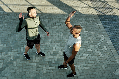 Buy stock photo High five, athlete and celebration for friends, fitness and personal trainer with motivation for client. Outdoor, above and people with smile for accomplishment, thank you and success for workout