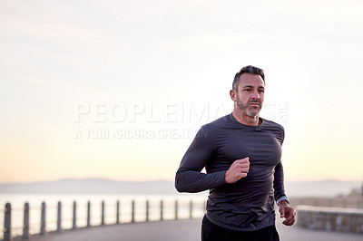 Buy stock photo Beach, running and man with exercise, energy and wellness with workout, practice and routine. Person, athlete and runner with performance, cardio and sports with body health, challenge and California