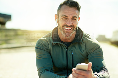 Buy stock photo Man, portrait and outdoor with mobile for fitness, music and wellness tracking app for care. Mature athlete, phone and smile in Portugal for streaming service, favorite playlist and warm up tutorial