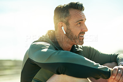 Buy stock photo Mature man, thinking or exercise break for outdoor running, fitness workout or cardio training. Recovery, music playlist or runner with earphones in practice for health, resting or sports performance