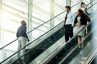 Buy stock photo People, escalator and suitcase in airport for travel, international journey or passing friends. Immigration, travelers or luggage on electric stairs for business trip with flight schedule in terminal