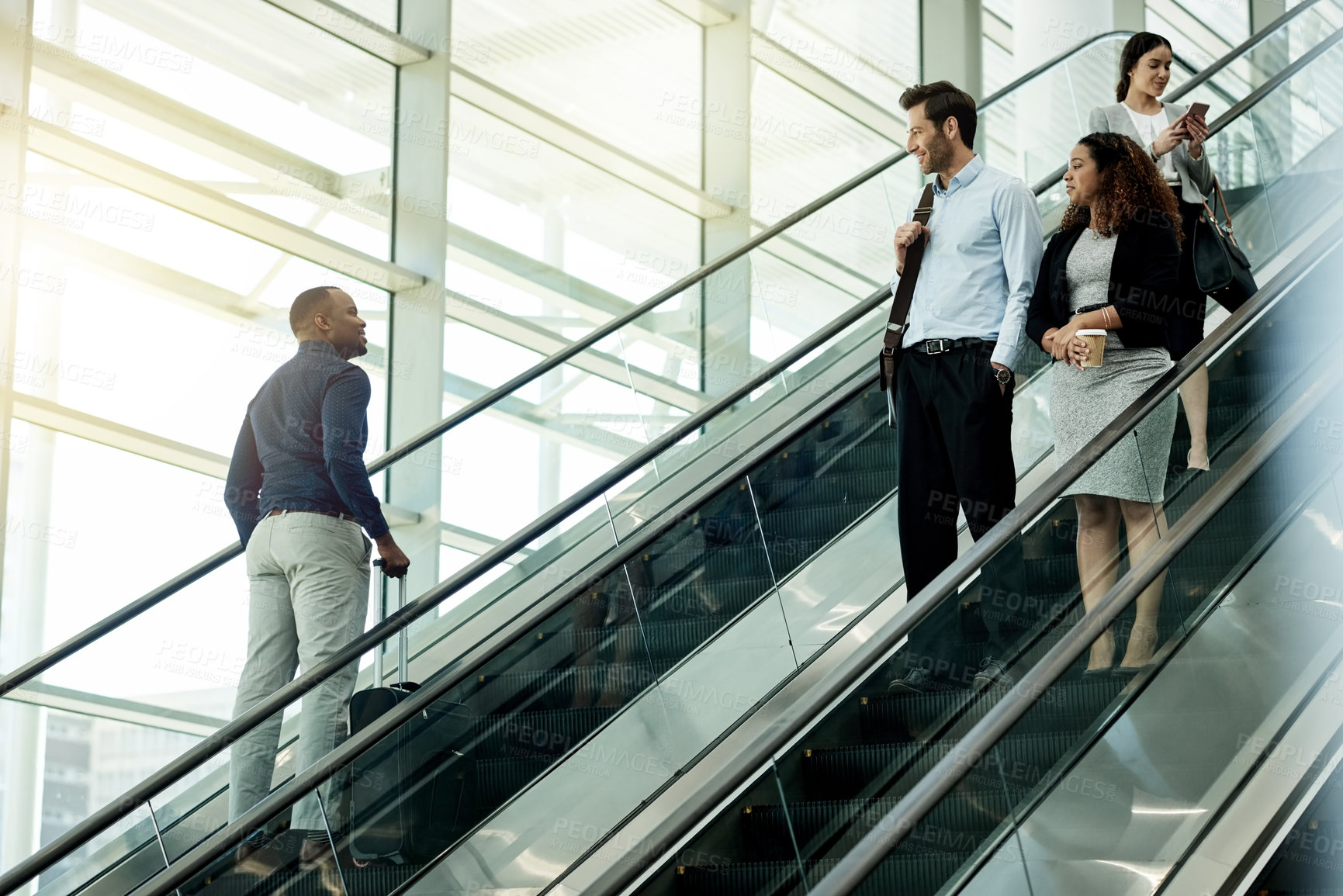 Buy stock photo People, escalator and suitcase in airport for travel, international journey or passing friends. Immigration, travelers or luggage on electric stairs for business trip with flight schedule in terminal