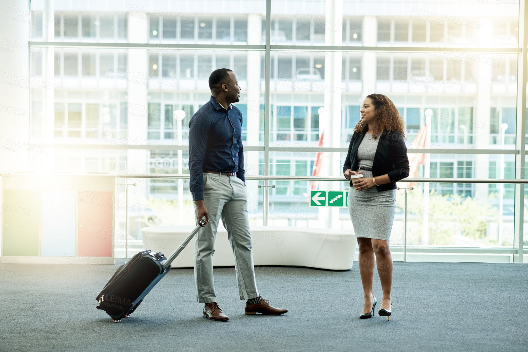 Buy stock photo Airport, lobby and business people with suitcase meeting for conference, seminar and convention. Modern building, professional workers and man and woman in conversation for travel, journey and trip