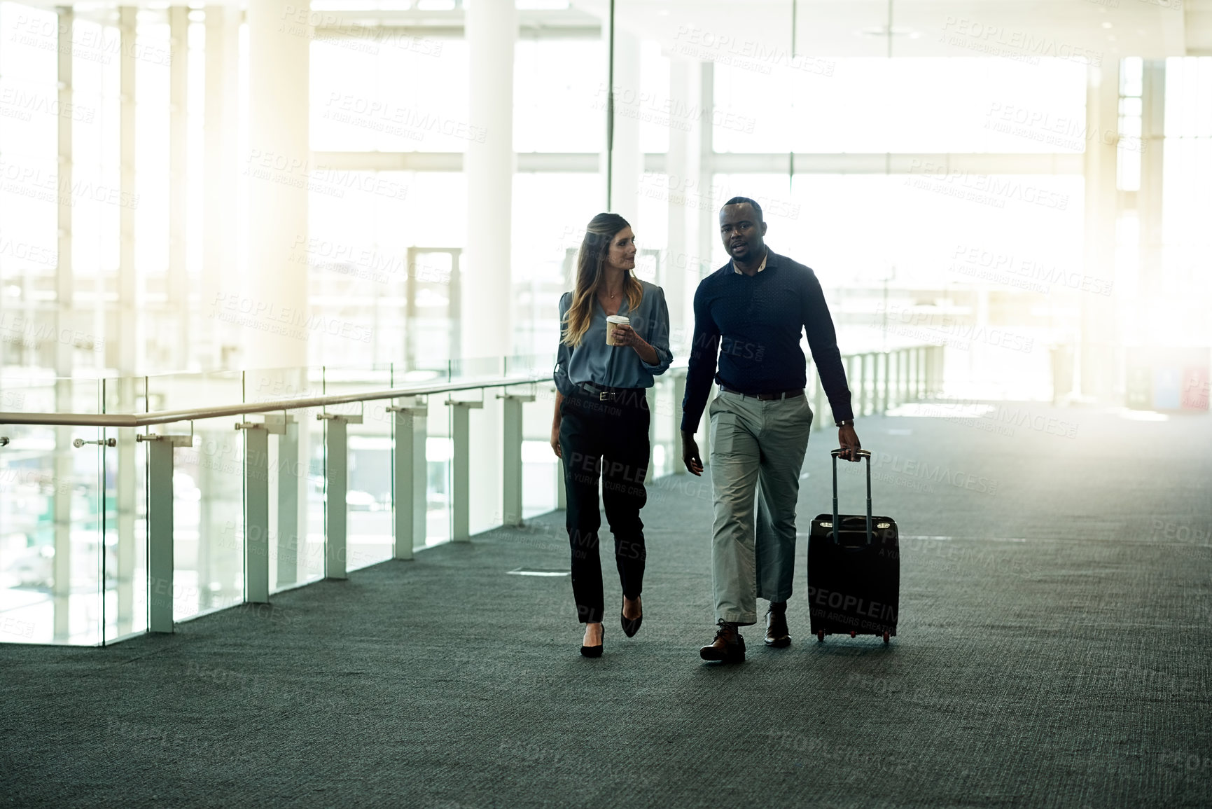 Buy stock photo Business, people and walking with luggage in lobby for international trip, convention and arrival for flight. Professional, teamwork and travel at airport for corporate journey, talking and departure