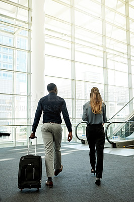 Buy stock photo Escalator, airport and back of business people with luggage for travel, commute and arrival in lobby. International trip, conference and man and woman walking for collaboration, meeting and seminar
