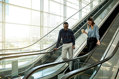Buy stock photo Escalator, suitcase and talking with business people in airport together for travel or trip. Collaboration, luggage and smile of woman employee with man colleague in lobby for international flight