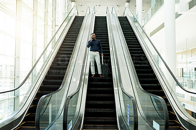 Buy stock photo Phone call, office and business black man on escalator for commute, travel and arrival in lobby. Transport, conference and African person on electric stairs with smartphone for contact and networking