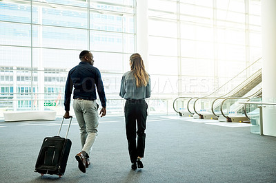 Buy stock photo Walking, airport and back of business people with luggage for travel, commute and arrival in lobby. International trip, conference and man and woman with suitcase for convention, meeting and seminar