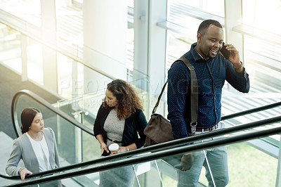 Buy stock photo Phone call, lobby and business man on escalator for commute, travel and arrival in office. Modern building, conference and African person on electric stairs with smartphone for contact and networking