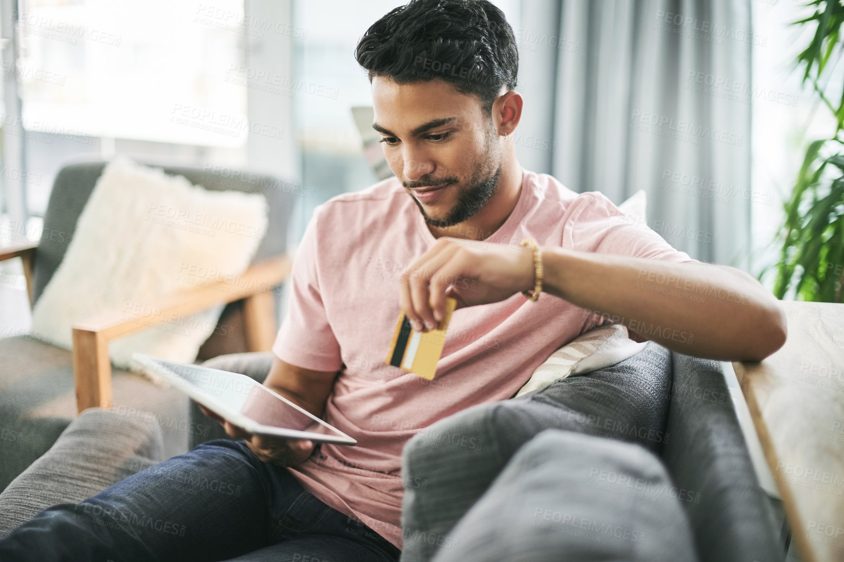Buy stock photo Credit card, home and man on sofa on tablet for online shopping, internet purchase and payment. Ecommerce, fintech and happy person on digital tech for website sale, subscription and banking app