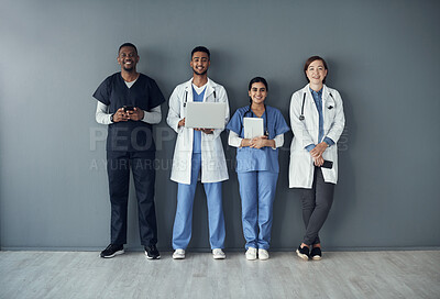 Buy stock photo Technology, doctors and portrait of team by wall for interview or public health conference and training session. People, medical staff and row for patient rounds or daily briefing, review and happy.
