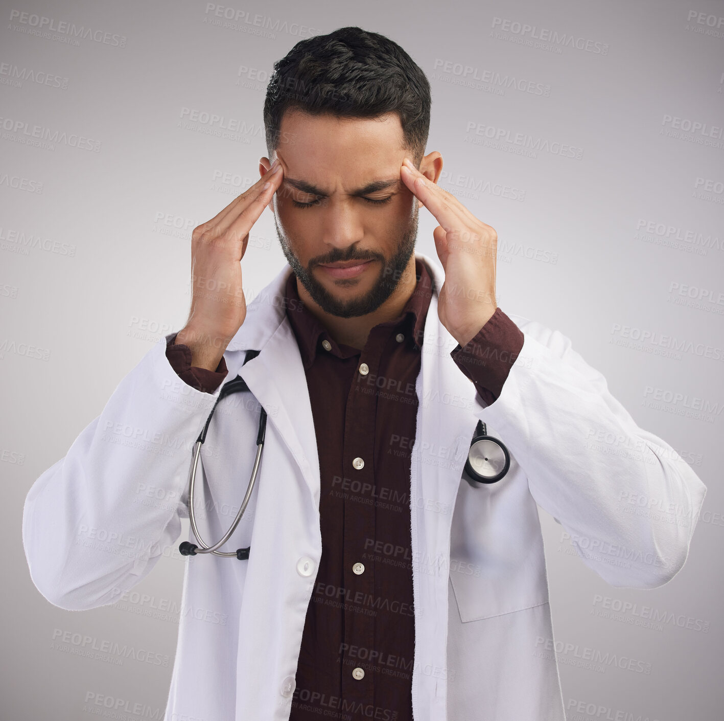 Buy stock photo Studio, male doctor and pain of headache in stress, burnout and mental health of medical employee. Tired, healthcare worker or man with migraine, anxiety and overworked pressure by white background