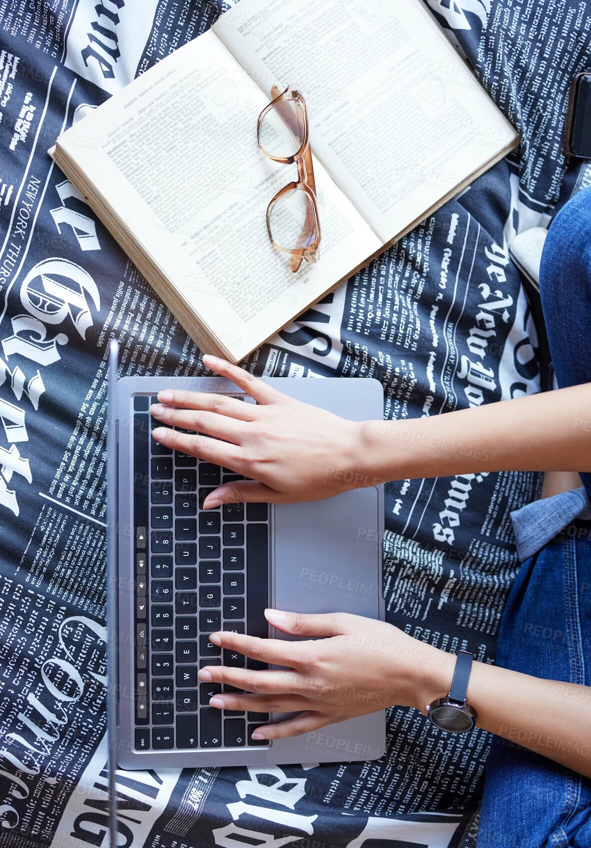 Buy stock photo Above, laptop and typing with textbook for student in college or university in studying for exam or test. Top view, computer and hands for writing, assignment or essay in school, deadline or due date
