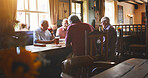 Group of senior men sitting together in a bar, bonding, senior friends enjoying a day in a pub
