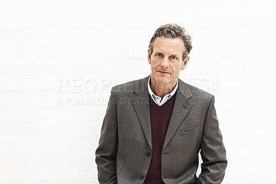 Buy stock photo Portrait of a businessman, isolated on a white background. A mature male executive looking confident about business in an office or studio