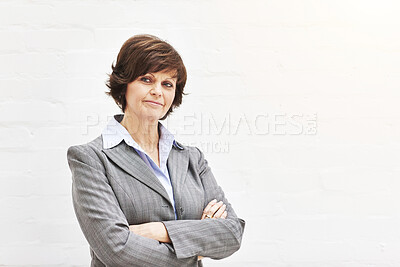 Buy stock photo Portrait of a businesswoman, isolated on a white background. A mature female executive looking confident about business in an office or studio