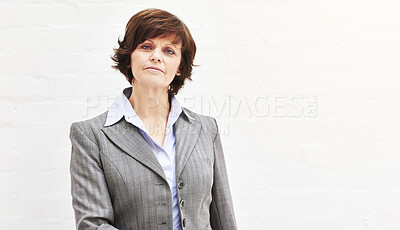 Buy stock photo Portrait of a businesswoman, isolated on a white background. A mature female executive looking confident about business in an office or studio
