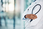 Closeup african american woman doctor standing with a stethoscope in the hospital. I need to listen to your heart beat. Come in for a medical checkup. Health and safety in the field of medicine