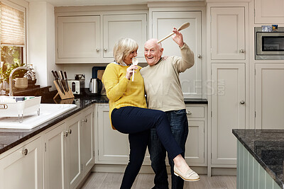 Buy stock photo Funny, dance and senior couple on a kitchen with music, happy and bond in their home. Retirement, celebration and silly old people with radio, podcast or fun with care, trust or support in a house