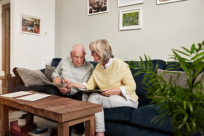Buy stock photo Senior couple, bills and reading documents for planning budget, financial assets and insurance information at home. Old man, woman and review paperwork for taxes, mortgage loan and retirement savings