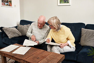 Buy stock photo Senior couple reading documents in home for planning budget, financial assets and legal contract for insurance policy. Man, woman and paperwork of investment information, bills and retirement savings