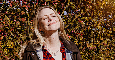 Buy stock photo Fall, nature and portrait of woman with peace, freedom and happiness outdoor in garden or backyard. Autumn, trees and leaves in forest or person relax in park and breathing fresh air with sunshine