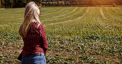 Buy stock photo Woman, field and nature with back view in countryside for fresh air, organic and sustainable development. Female farmer, casual fashion or clothes on grass, silage or ground for eco friendly farming