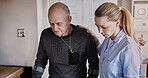 Medical, help and nurse with senior man in a nursing home kitchen with crutches and consultation. Healthcare, career and female caregiver with elderly male patient in retirement at modern house.