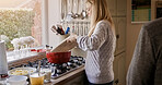 Woman, cooking and stove in home kitchen with plate, healthy ingredients and meal prep for nutrition. Chef person, pot and food with idea, thinking and process for diet, lunch or dinner in house