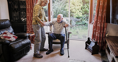Buy stock photo Elderly, couple and help with walking stick for care, support or assistance on sofa in living room of home. Senior, woman or man with disability or cane in lounge of retirement with love and recovery