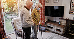 Senior, couple and help with walking stick for care, support or assistance on sofa in living room of home. Elderly, woman or man with disability or cane in lounge of retirement with love and recovery